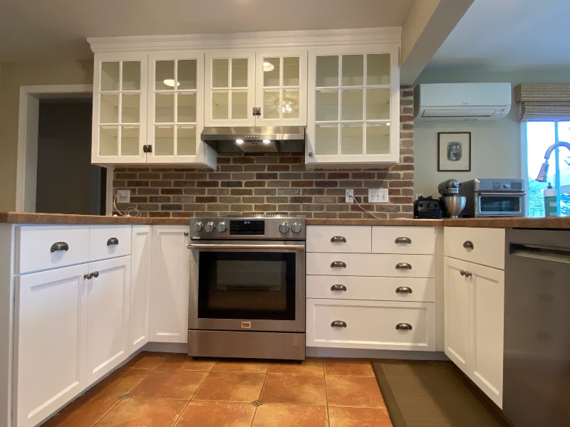 Farm-style white kitchen after cabinet refacing in Suffield, CT