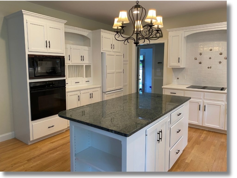 Professionally painted kitchen cabinets with smooth spray finish