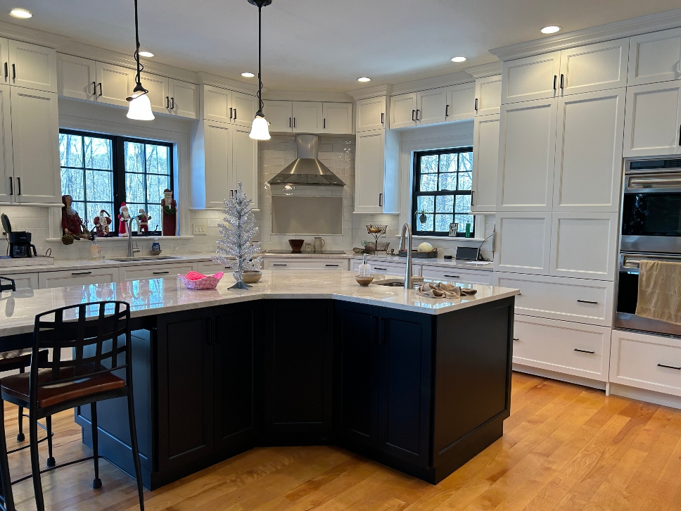 Black and white two-tone kitchen cabinet refacing project