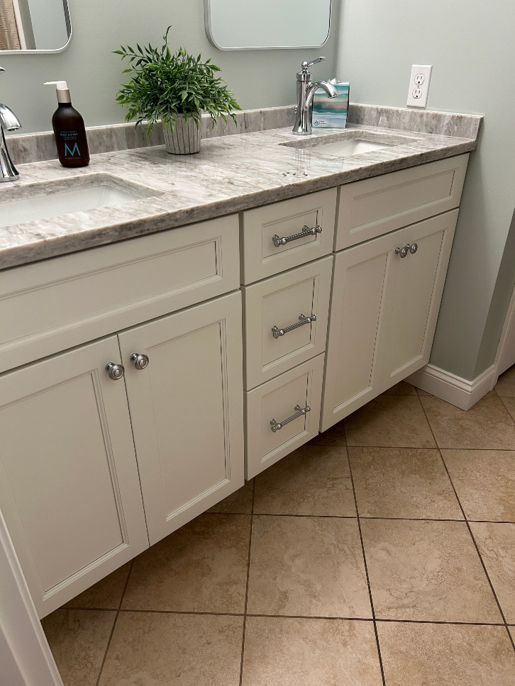 Bathroom vanity after professional white shaker cabinet refacing