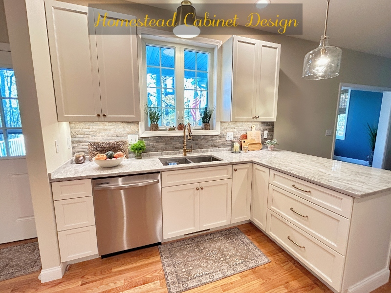 Completed kitchen cabinet refacing project with new doors and updated hardware