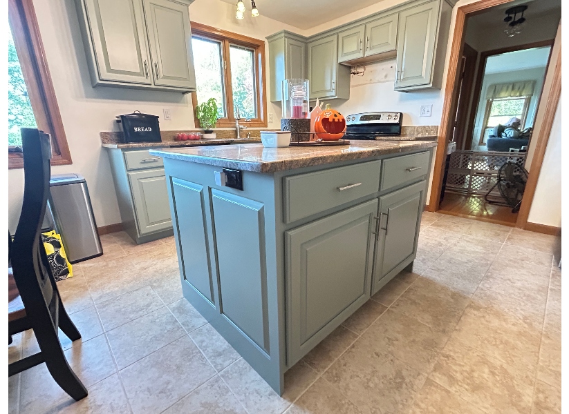 After kitchen island refacing in Belchertown MA — matching sage green shaker doors with brushed nickel bar pulls