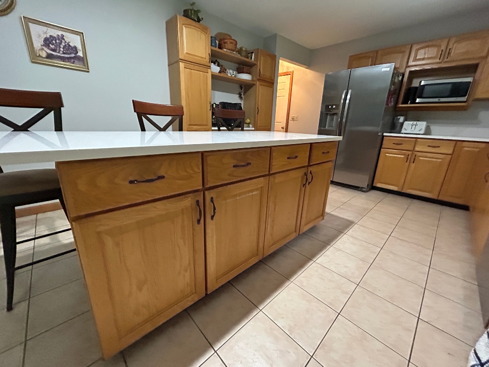 Dated honey oak cabinets before cabinet refacing in Longmeadow MA