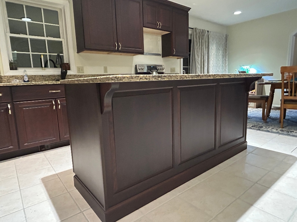Detail view of oak to cherry cabinet refacing in Warren, MA