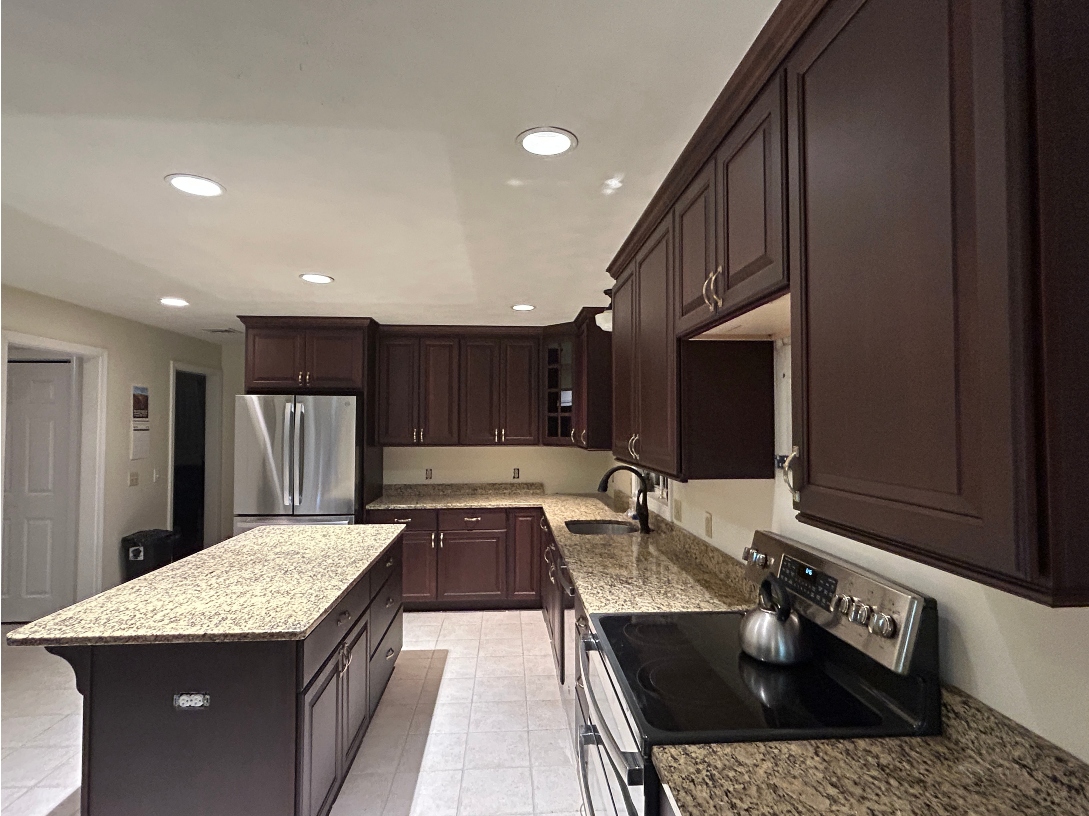 Cherry cabinet refacing after transformation in Warren, MA