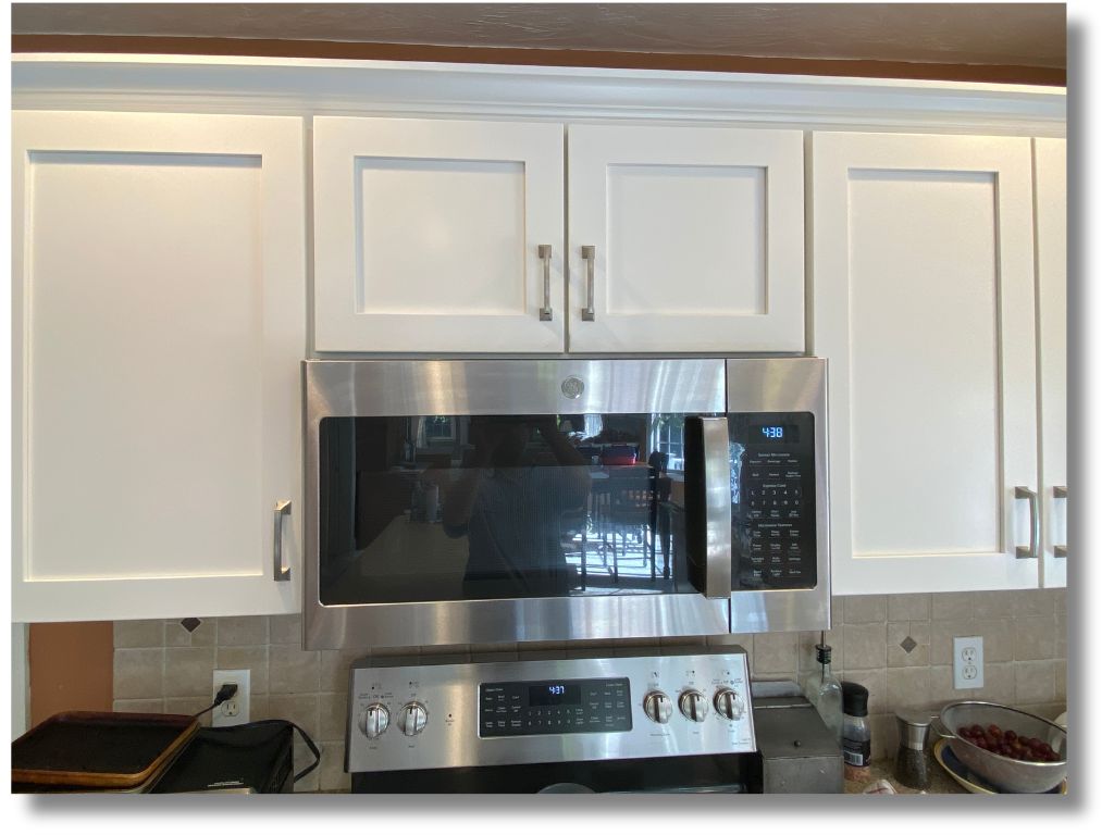 White shaker cabinet refacing project in Wilbraham Massachusetts — clean modern finish with new hardware