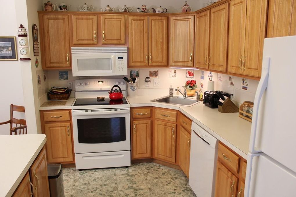 Dated kitchen cabinets before professional painting — typical starting point for a cabinet painting project