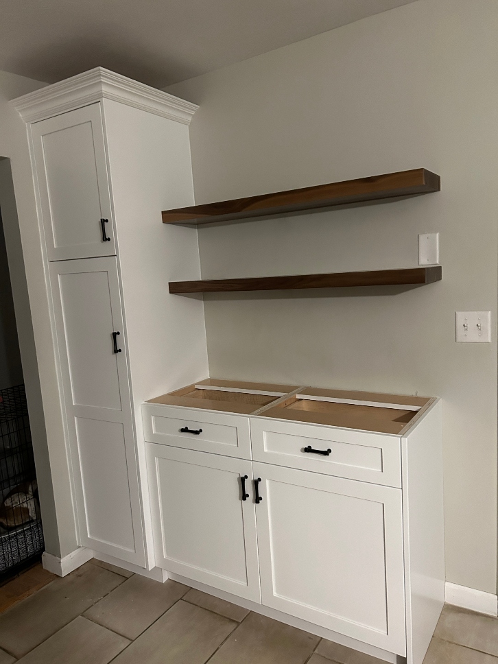 Custom walnut floating kitchen shelves
