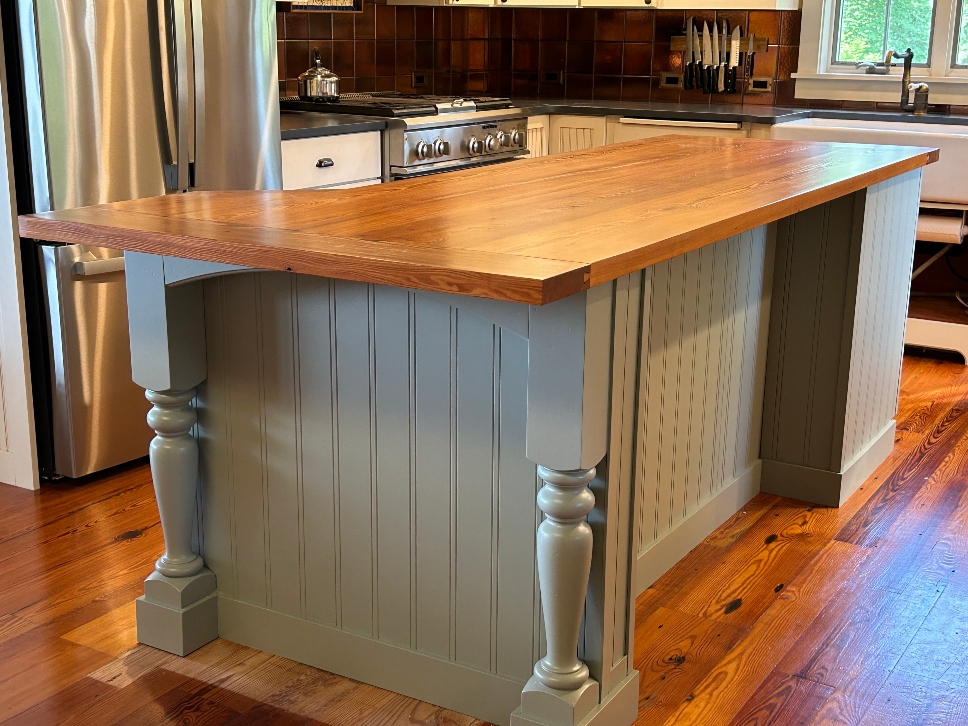 Kitchen island with decorative furniture-style legs