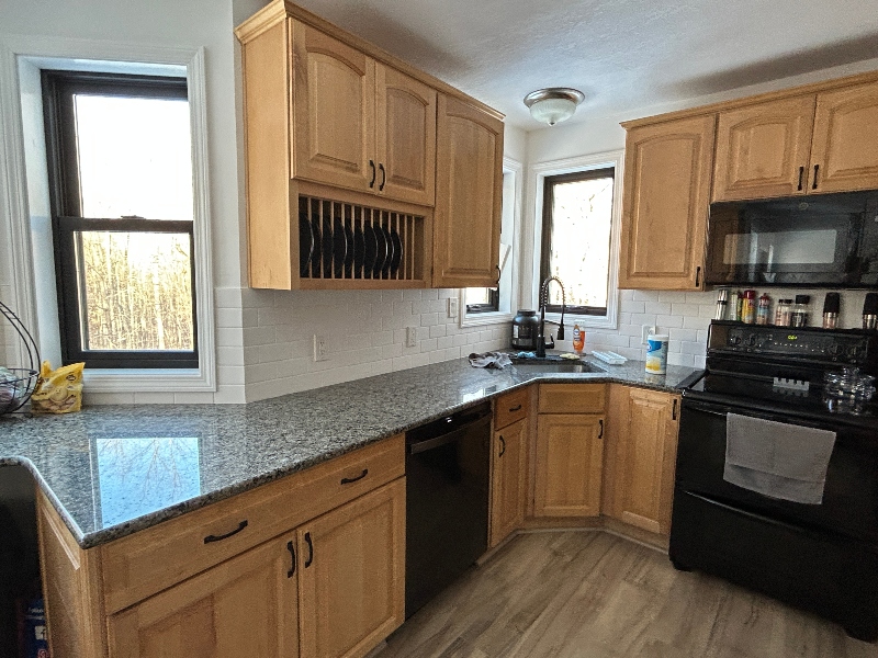 Dated light wood kitchen cabinets before refacing