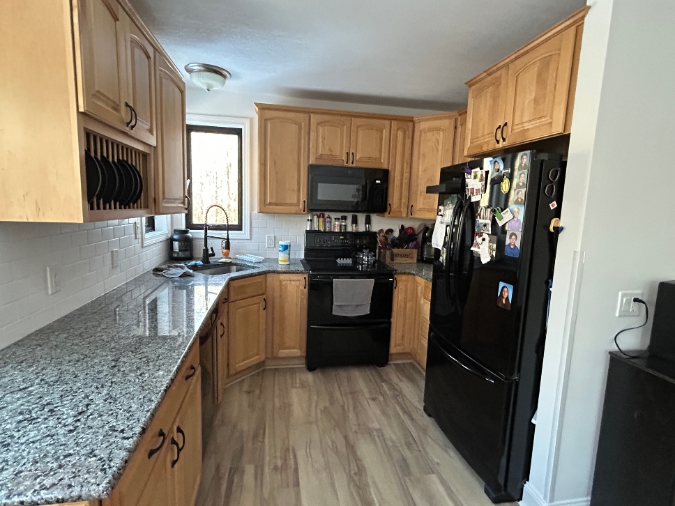Natural maple kitchen cabinets before professional painting