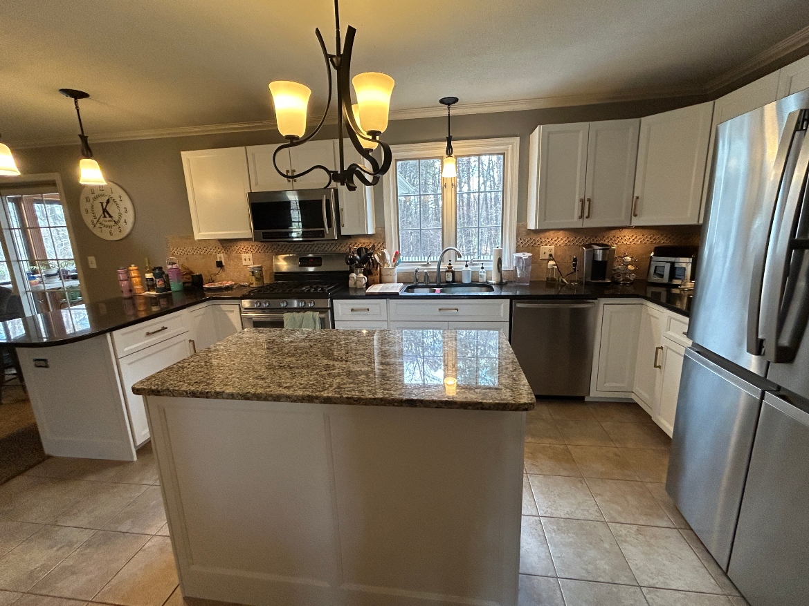 After cabinet refacing in Ludlow MA — oak cabinets refaced with white shaker doors and updated hardware