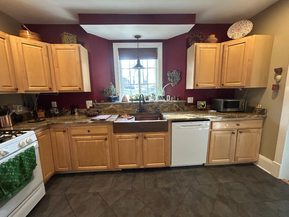 Kitchen cabinets before rustic white oak refacing in Pittsfield, MA