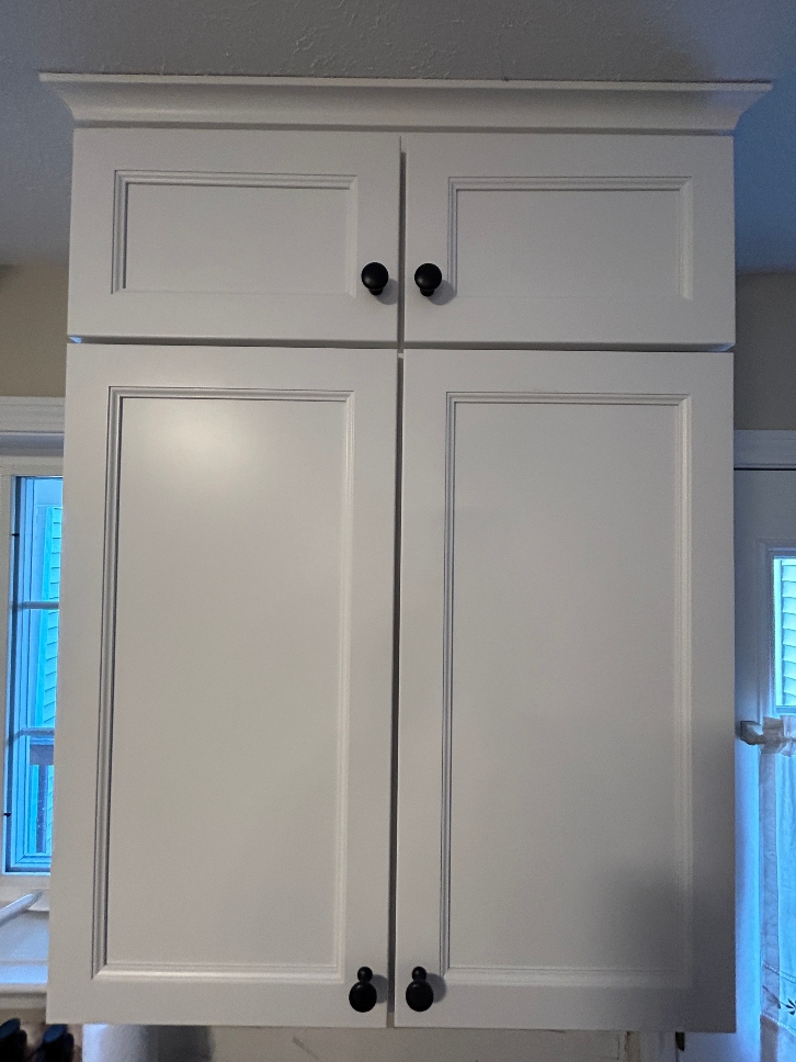 Soffit cabinets added above existing kitchen cabinets — new upper cabinet boxes installed to fill soffit space and add storage