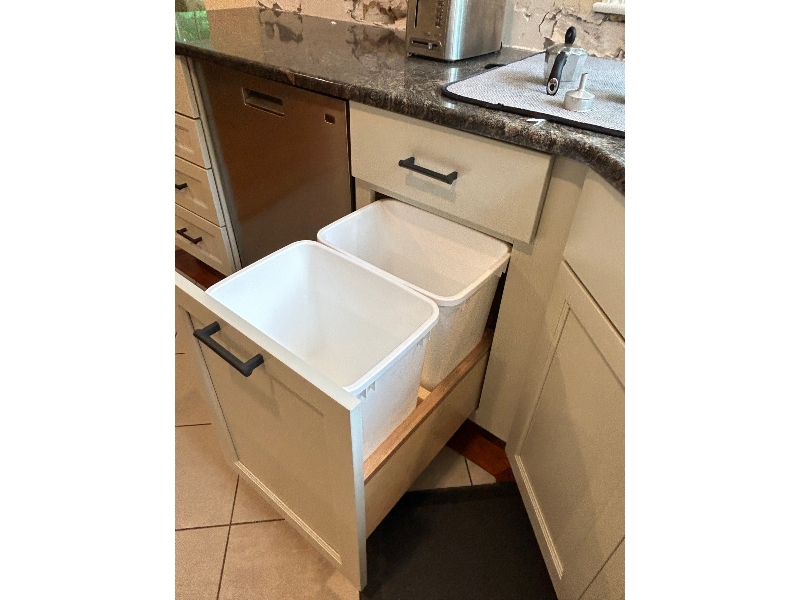 Trash can pull-out cabinet — built-in hidden trash and recycling in dedicated base cabinet drawer