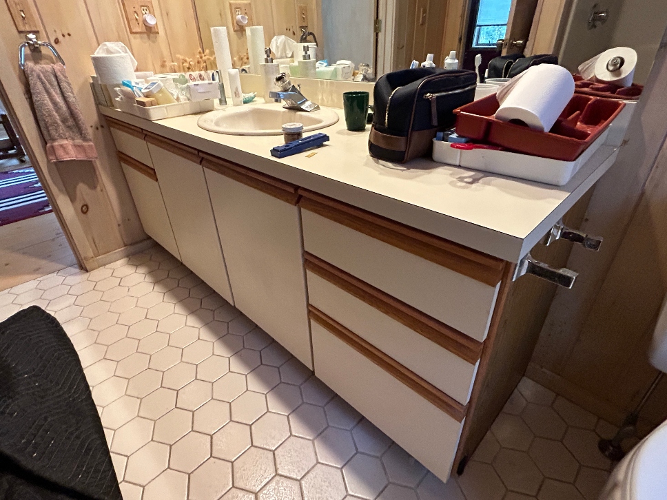 Bathroom vanity before cabinet refacing in Becket, MA