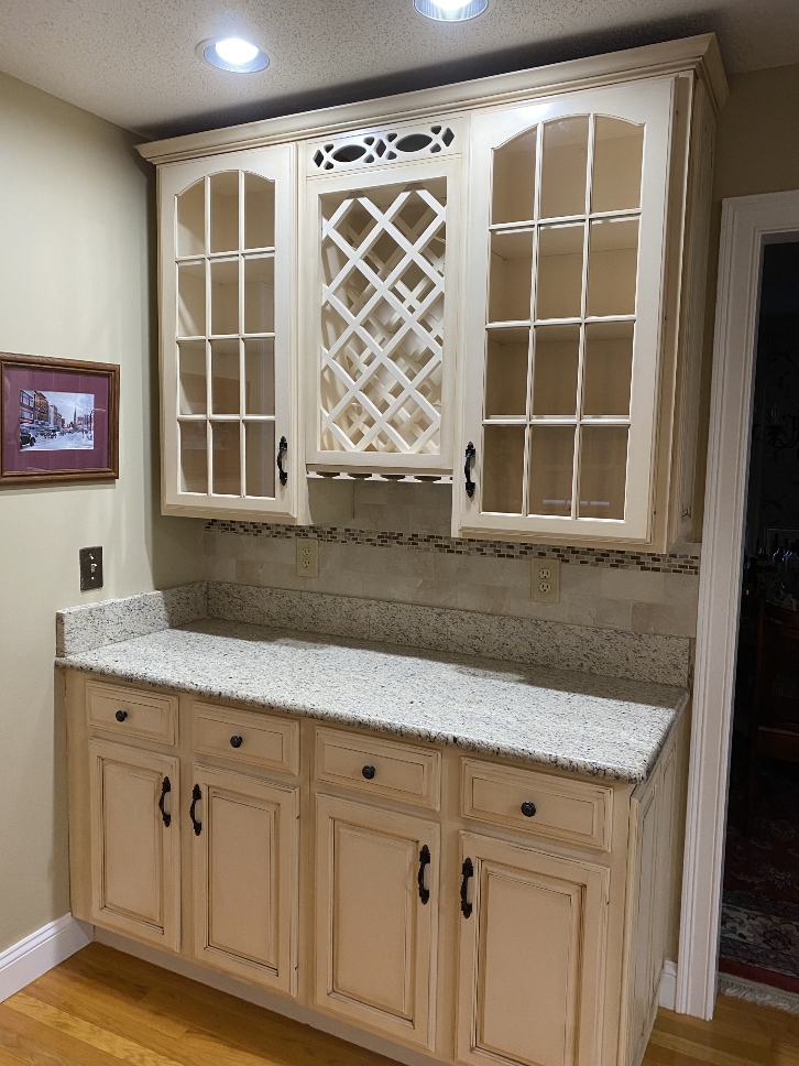 White cabinets with decorative brown glaze finish